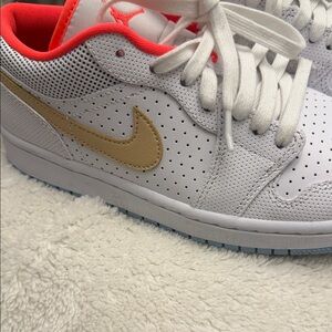 Nike White and Gold Sneakers with Red Accents